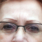 Permanent eyebrows and eyeliner along with glasses